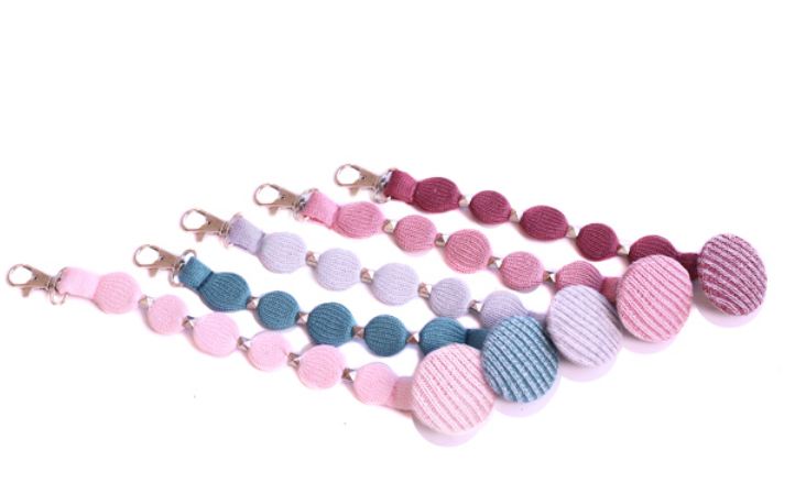 מחזיק מוצץ כפתור